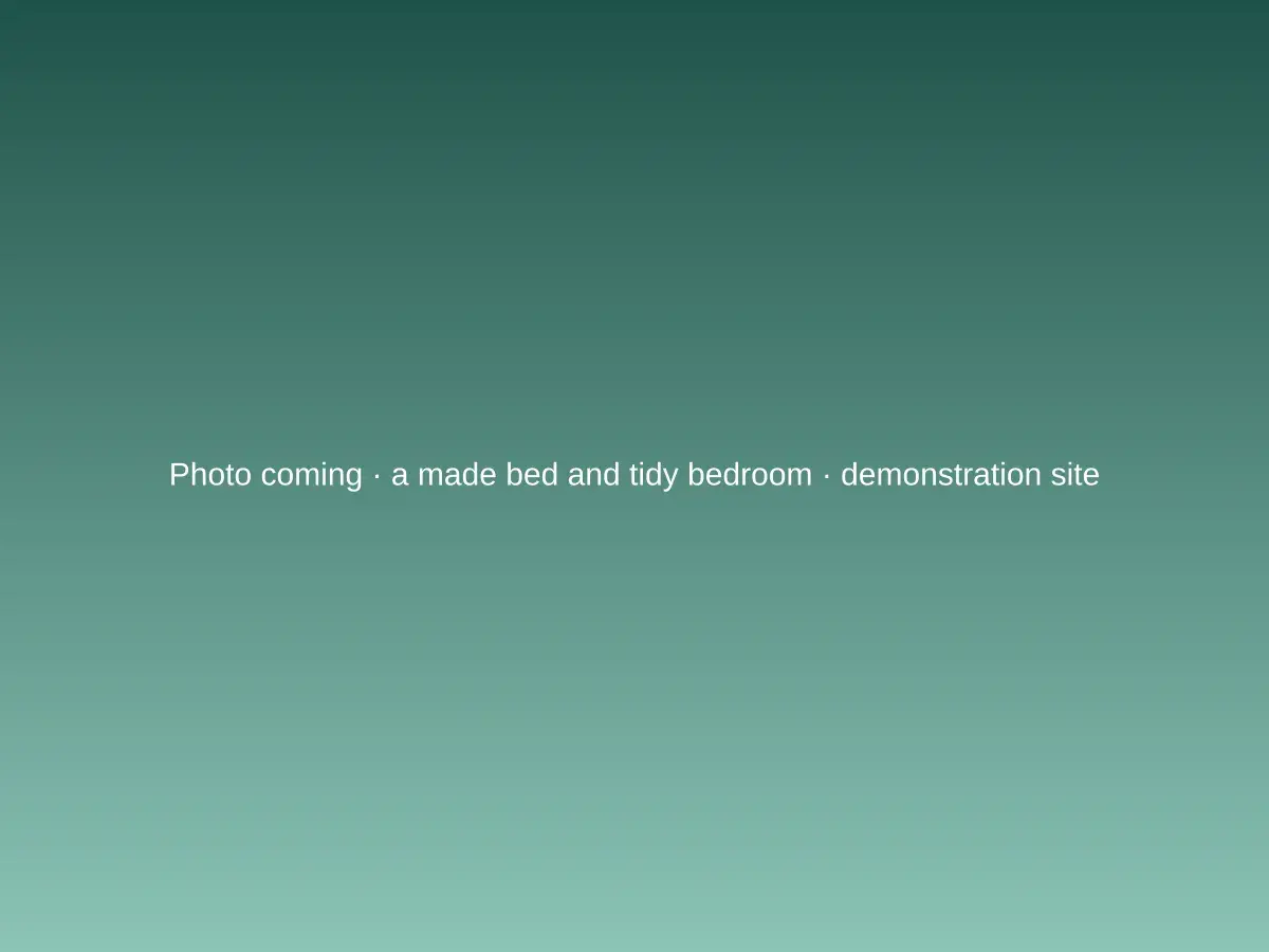 Made bed and tidy bedroom